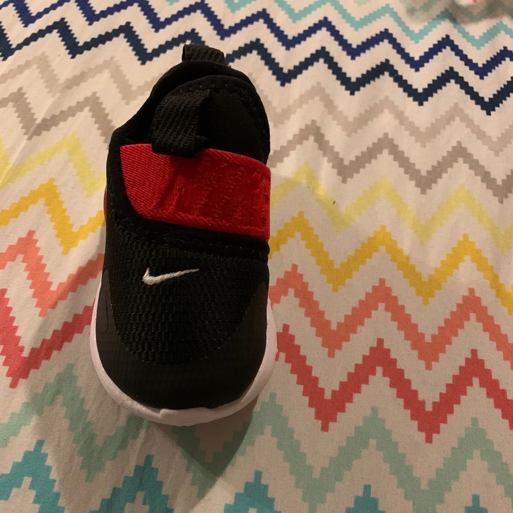 Red, black and white Nike shoes.